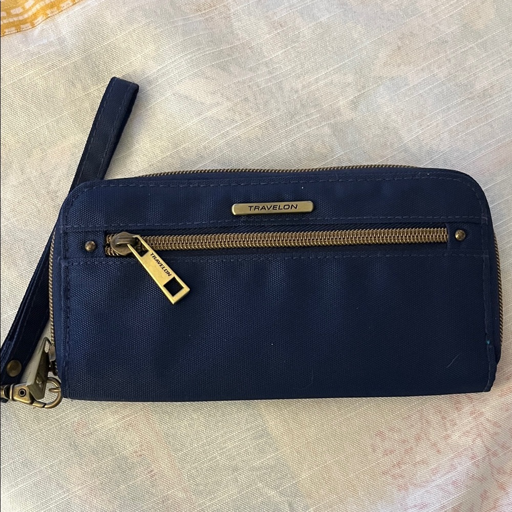 Travelon‎ navy blue anti-theft travel wallet made of durable synthetic fabric.